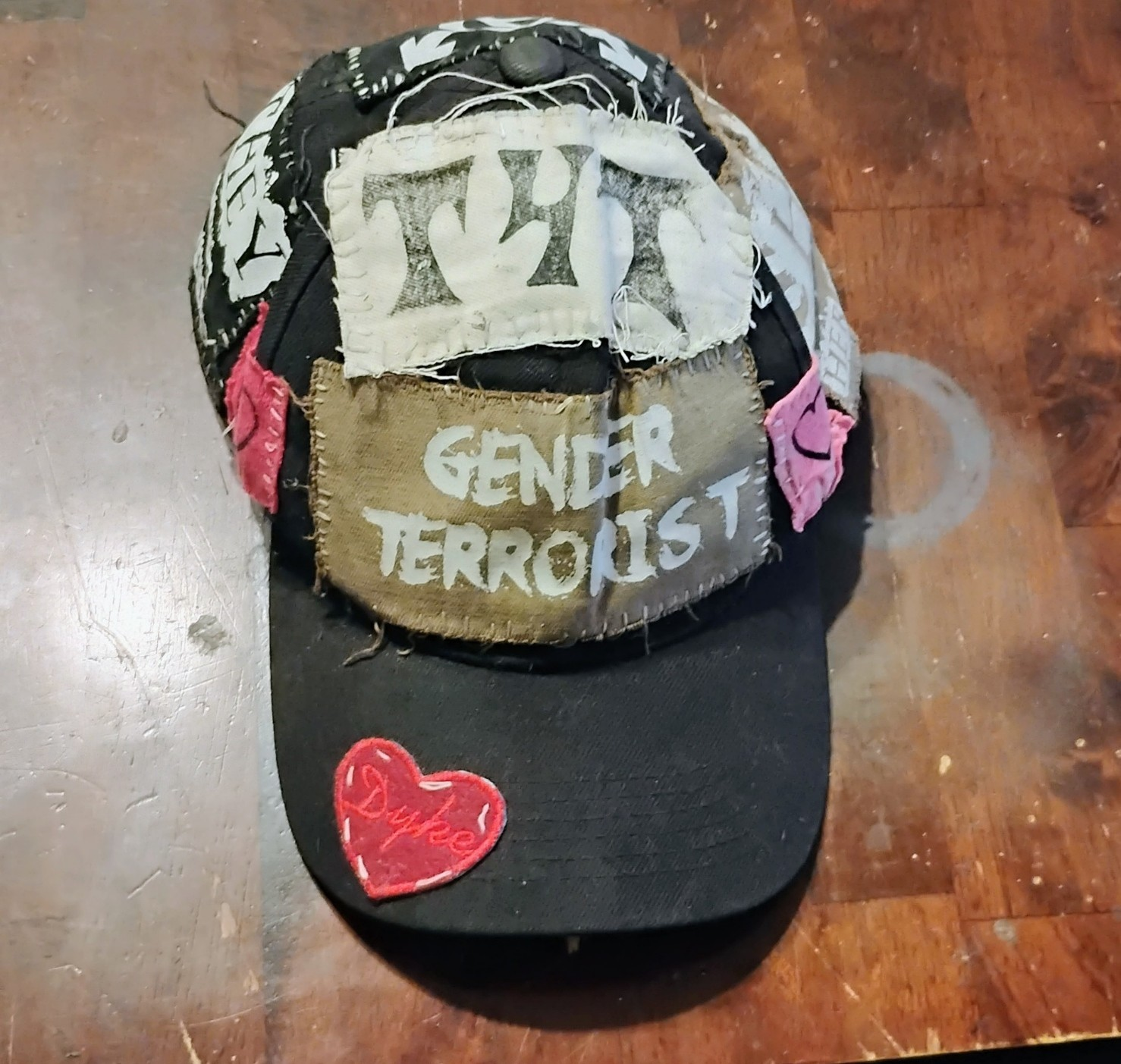 front of vanta's own gender terrorist hat